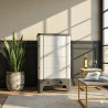 Poêle radiant électrique E40 SL La Valmarecchia en céramique blanche dans un salon chaleureux