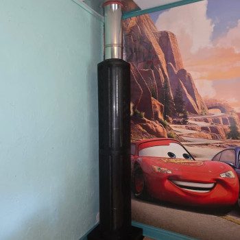 Habillage conduit Dixneuf installé dans une chambre traversée par le conduit de fumée